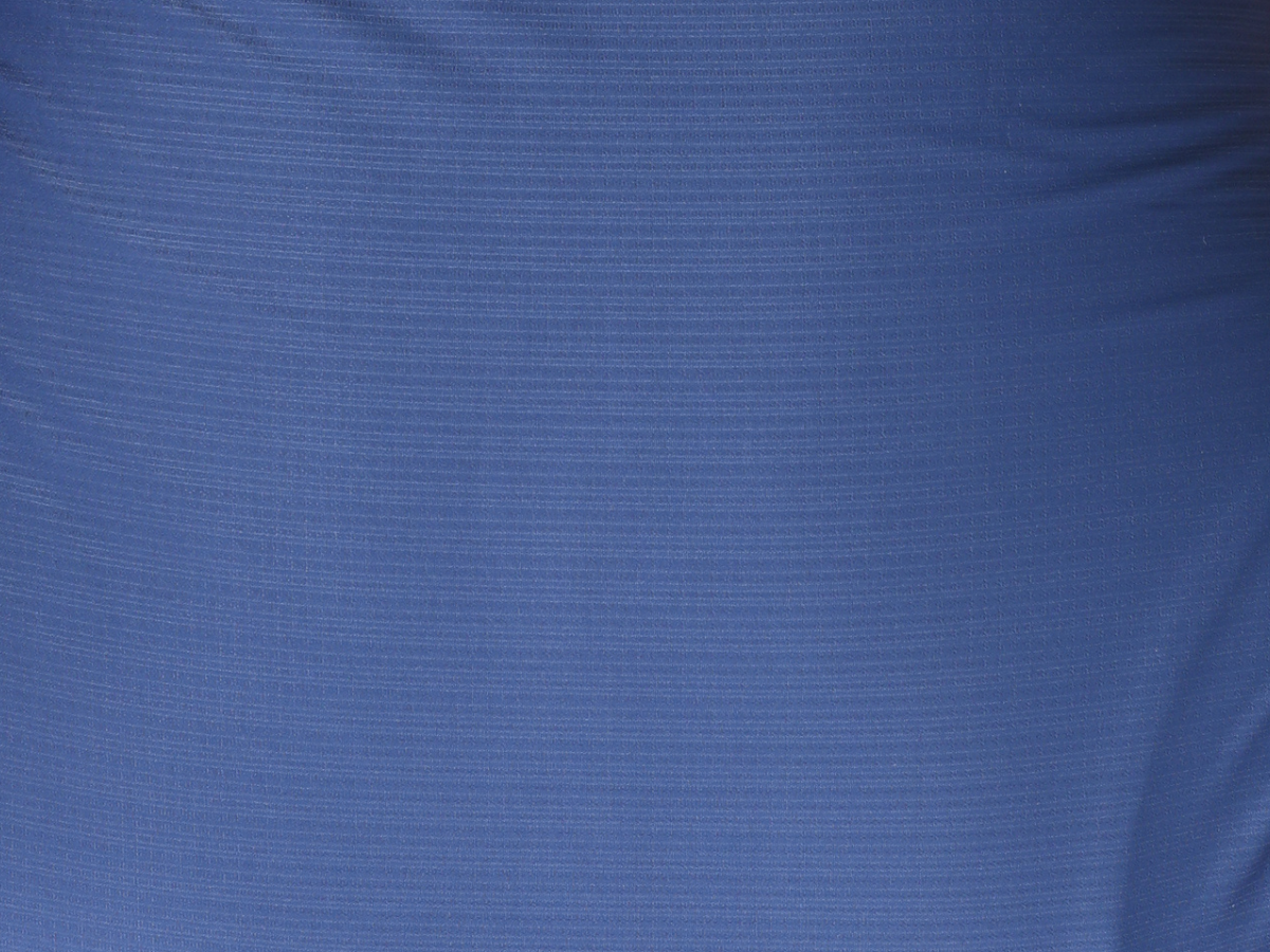 Zoomed-in view of the Vision Shirt Tee's soft and flexible fabric, engineered for moisture management and ease of movement.