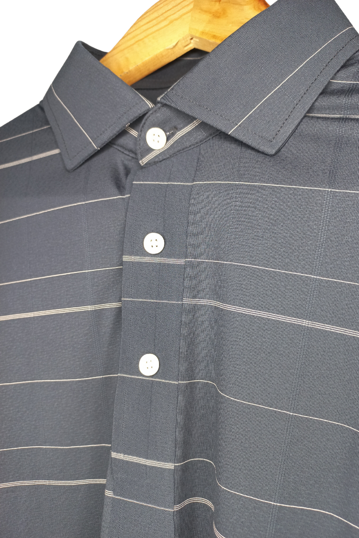 Neatly stitched collar and placket for a refined and professional finish.