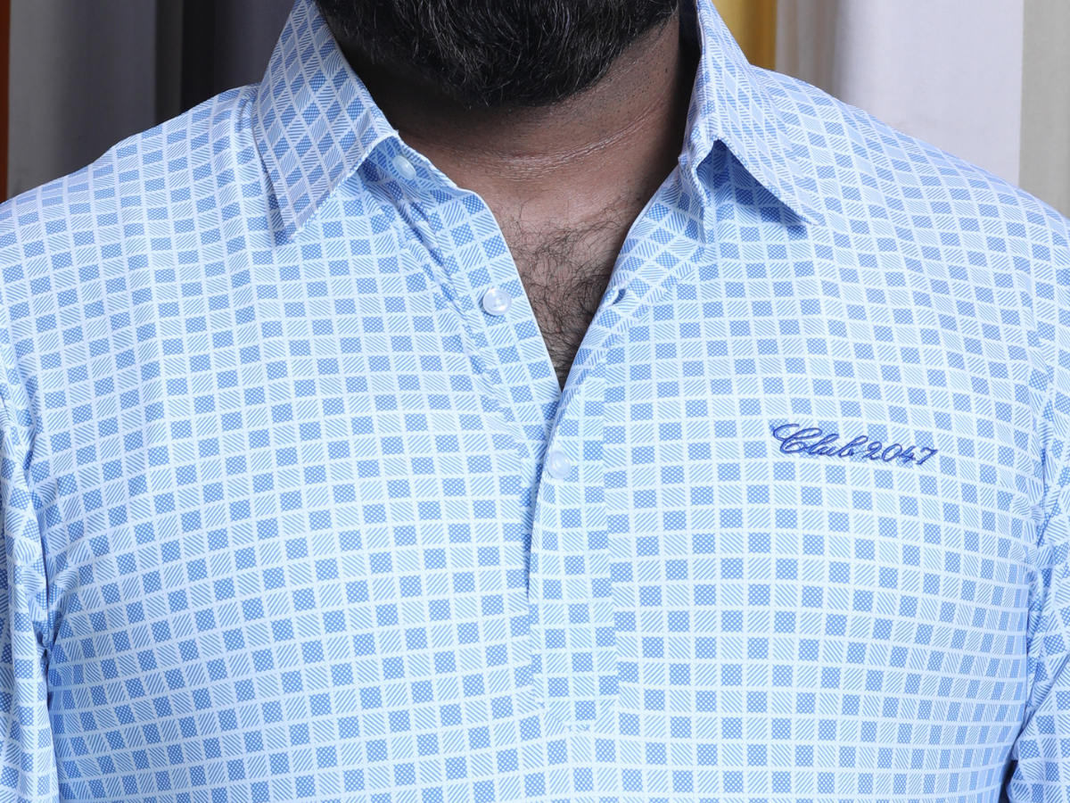Detailed view of the structured collar and placket, highlighting the formal style and refined stitching of the Corporate Light Blue Checks Shirt.