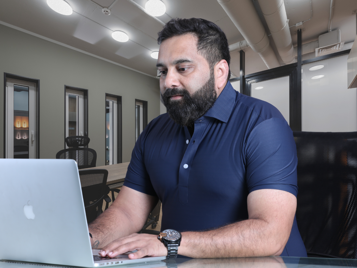 Vision Shirt Tee worn in a professional workspace, providing the ideal balance of formality and comfort