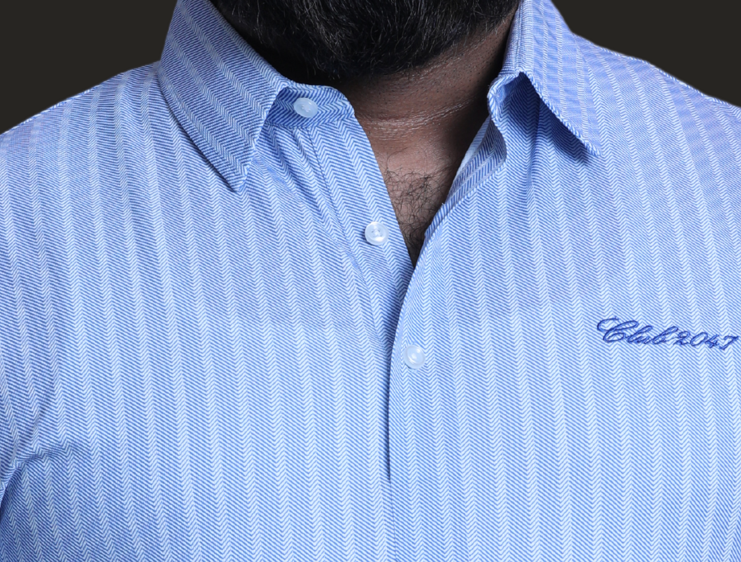 Zoomed-in view of a luxury checkered dress shirt featuring a sharp hard collar, elegant barrel cuffs, and a sleek button placket. The premium check pattern is intricately woven into the breathable ice fabric, offering a polished, professional look with long-lasting wrinkle resistance. A perfect business shirt that transitions seamlessly from office to after-hours events.